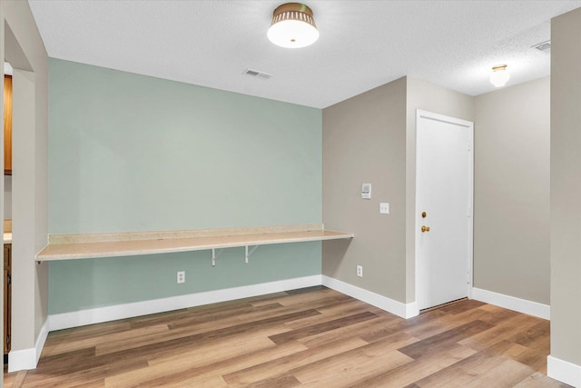 2567 Clayton Blvd Unit 2567, Champaign, IL 61822 - spare room with wood finished floors, baseboards, and a textured ceiling