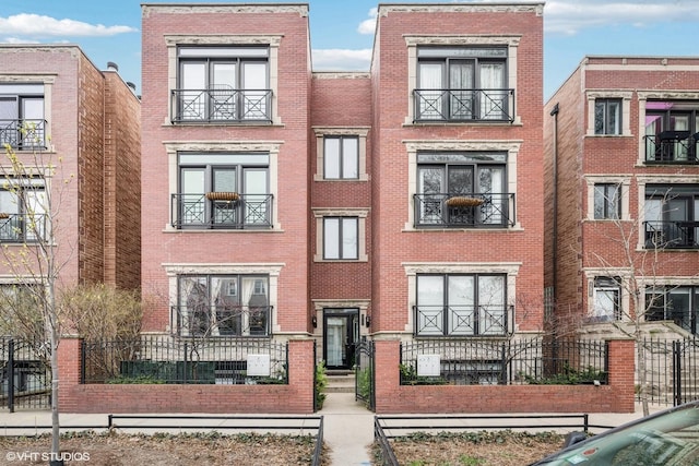 view of front of house featuring brick siding