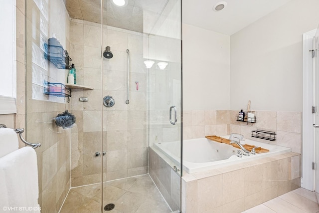 full bathroom featuring a stall shower, tile patterned flooring, and a bath