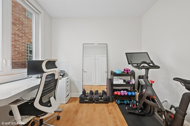 office space featuring wood finished floors and baseboards