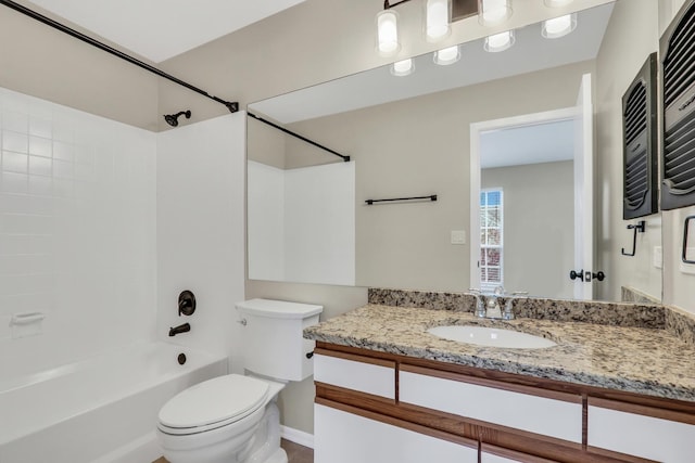 full bathroom with shower / bathtub combination, vanity, and toilet