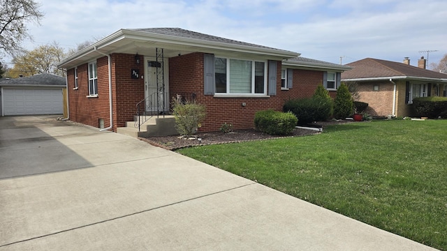 959 E 166th St, South Holland, IL 60473 - view of front of home with a detached garage, concrete driveway, an outdoor structure, a front yard, and brick siding