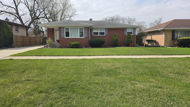 959 E 166th St, South Holland, IL 60473 - view of front facade featuring fence, brick siding, and a front yard