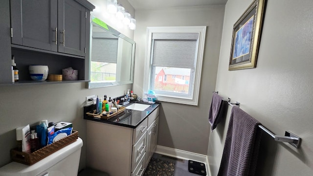 959 E 166th St, South Holland, IL 60473 - half bath with vanity, toilet, baseboards, and visible vents
