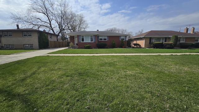 959 E 166th St, South Holland, IL 60473 - view of front facade featuring brick siding, driveway, a front yard, and fence