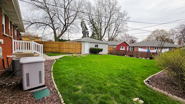 959 E 166th St, South Holland, IL 60473 - view of yard featuring a fenced backyard, an outbuilding, and central air condition unit