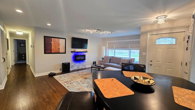 959 E 166th St, South Holland, IL 60473 - dining space featuring a glass covered fireplace, baseboards, recessed lighting, and dark wood finished floors