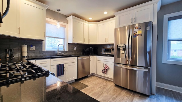 959 E 166th St, South Holland, IL 60473 - kitchen with plenty of natural light, tasteful backsplash, stainless steel appliances, and a sink