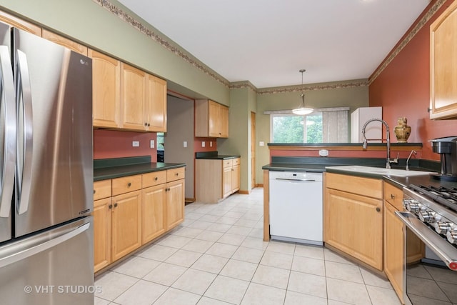 1754 Landreth Ct, Aurora, IL 60504 - kitchen with light tile patterned flooring, dark countertops, a sink, appliances with stainless steel finishes, and decorative light fixtures