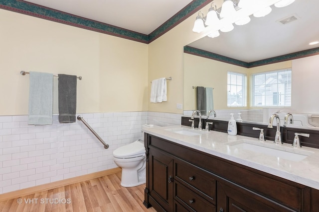 1754 Landreth Ct, Aurora, IL 60504 - full bath featuring visible vents, a sink, a wainscoted wall, and tile walls