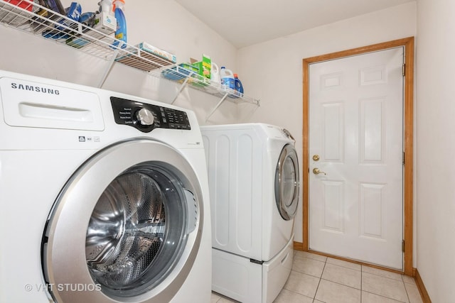 1754 Landreth Ct, Aurora, IL 60504 - laundry room featuring laundry area, washer and clothes dryer, baseboards, and light tile patterned floors