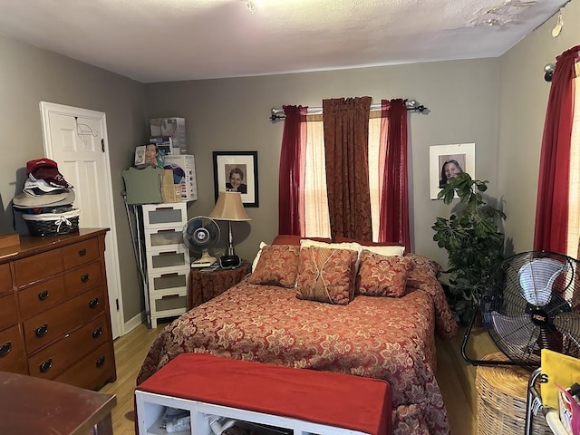 bedroom featuring light wood-style floors