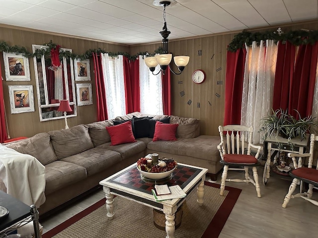 living room with wood finished floors and wooden walls