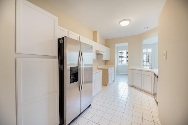 5464 Mayflower Jct, Rolling Meadows, IL 60008 - kitchen with light tile patterned floors, stainless steel appliances, light countertops, a sink, and white cabinetry
