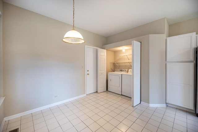 5464 Mayflower Jct, Rolling Meadows, IL 60008 - clothes washing area featuring light tile patterned floors, washing machine and clothes dryer, laundry area, and baseboards