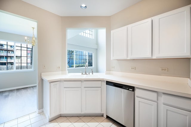5464 Mayflower Jct, Rolling Meadows, IL 60008 - kitchen with an inviting chandelier, light countertops, white cabinets, dishwasher, and a sink