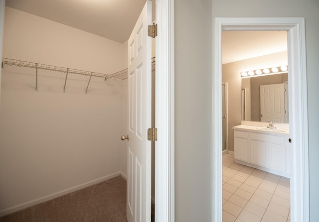 5464 Mayflower Jct, Rolling Meadows, IL 60008 - walk in closet with light tile patterned floors and a sink