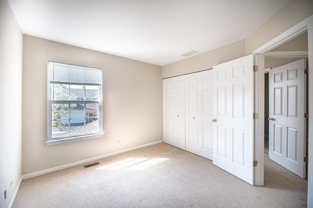 5464 Mayflower Jct, Rolling Meadows, IL 60008 - unfurnished bedroom featuring a closet, carpet flooring, baseboards, and visible vents