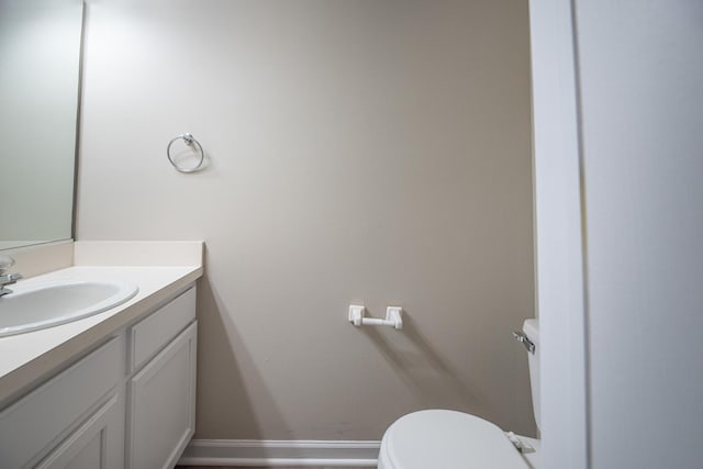 5464 Mayflower Jct, Rolling Meadows, IL 60008 - half bathroom featuring baseboards, toilet, and vanity