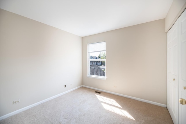 5464 Mayflower Jct, Rolling Meadows, IL 60008 - unfurnished bedroom with visible vents, a closet, baseboards, and carpet floors