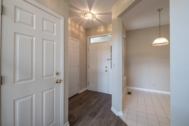 5464 Mayflower Jct, Rolling Meadows, IL 60008 - foyer featuring baseboards and wood finished floors