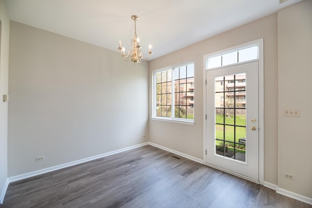 5464 Mayflower Jct, Rolling Meadows, IL 60008 - doorway with dark wood-style floors, baseboards, visible vents, and a chandelier