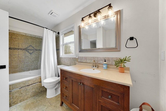 4240 Hearthstone Ln, Belvidere, IL 61008 - full bathroom with toilet, tiled shower / bath combo, vanity, visible vents, and tile patterned floors