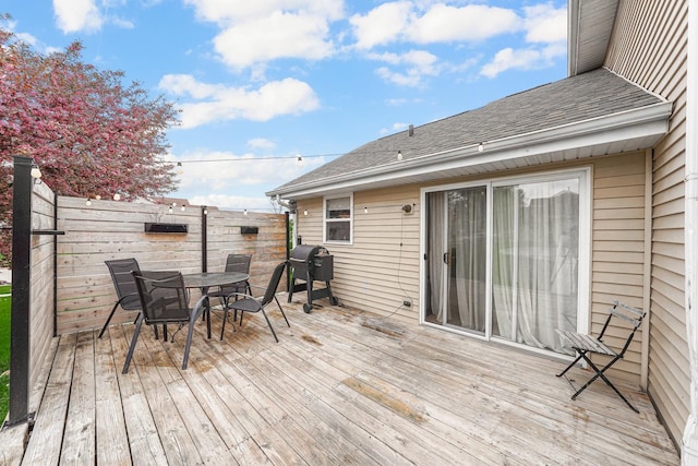 4240 Hearthstone Ln, Belvidere, IL 61008 - wooden deck featuring area for grilling, outdoor dining area, and fence