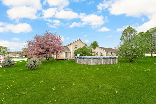 4240 Hearthstone Ln, Belvidere, IL 61008 - view of yard with a covered pool