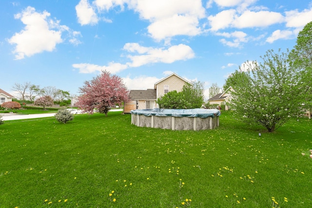4240 Hearthstone Ln, Belvidere, IL 61008 - view of yard with a covered pool