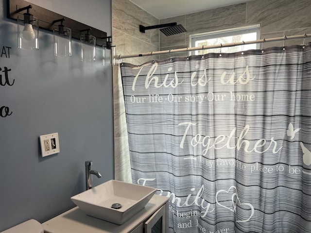 full bath with vanity and a shower with curtain