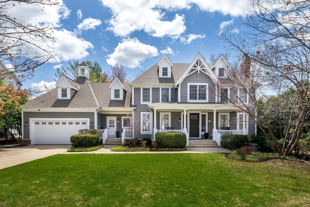 345 Oak St, Glen Ellyn, IL 60137 - view of front facade featuring a shingled roof, an attached garage, a front lawn, a porch, and driveway