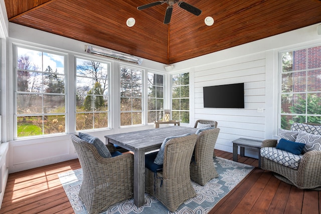 sunroom / solarium with a ceiling fan