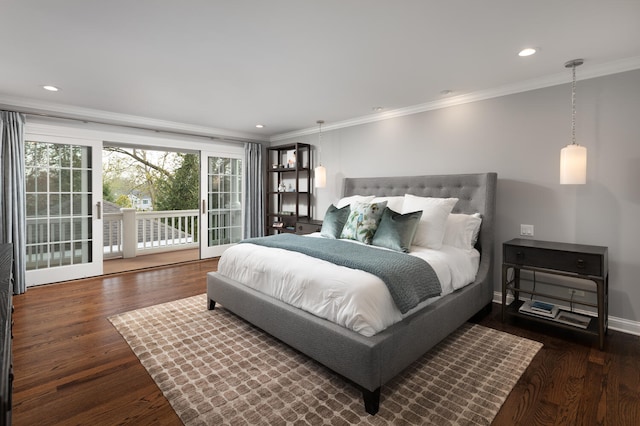 bedroom featuring crown molding, wood finished floors, and access to exterior