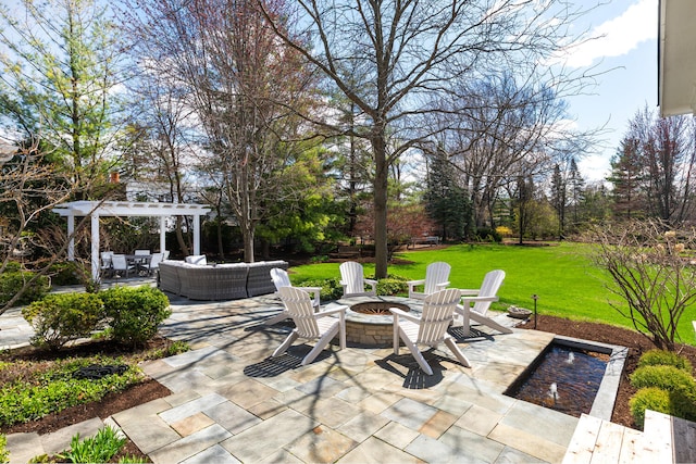 view of patio / terrace with an outdoor living space with a fire pit and a pergola