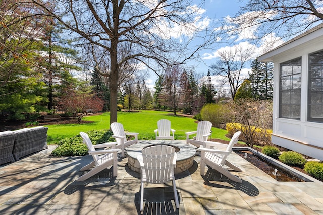 view of patio with an outdoor fire pit