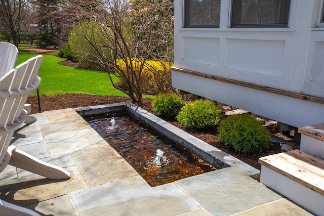 exterior space featuring a hot tub