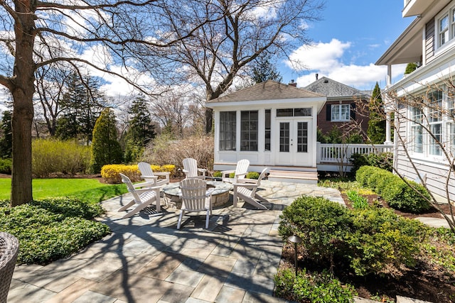 view of patio featuring french doors and a deck