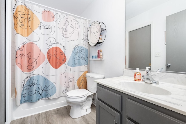 611 Cedar Ct, Romeoville, IL 60446 - full bathroom featuring vanity, shower / bath combo with shower curtain, toilet, and wood finished floors