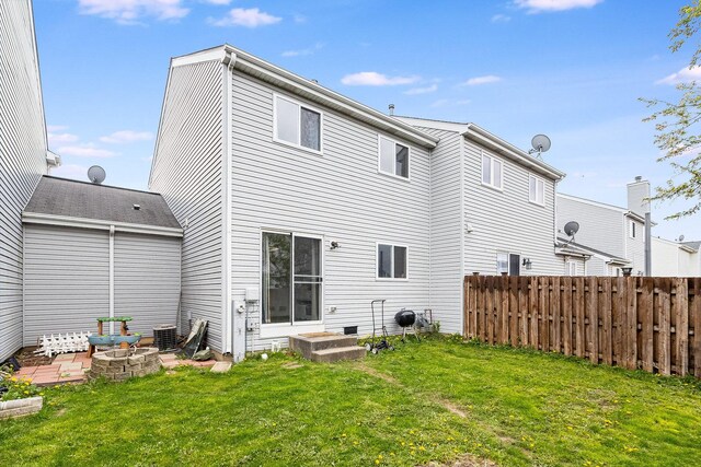 611 Cedar Ct, Romeoville, IL 60446 - rear view of house with a yard, fence, and cooling unit