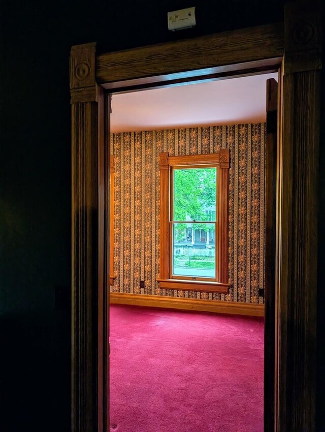 907 W Church St, Champaign, IL 61821 - carpeted spare room featuring wallpapered walls