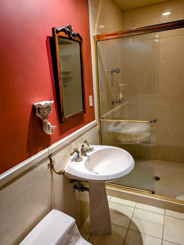 907 W Church St, Champaign, IL 61821 - bathroom with a stall shower, tile patterned floors, and a sink