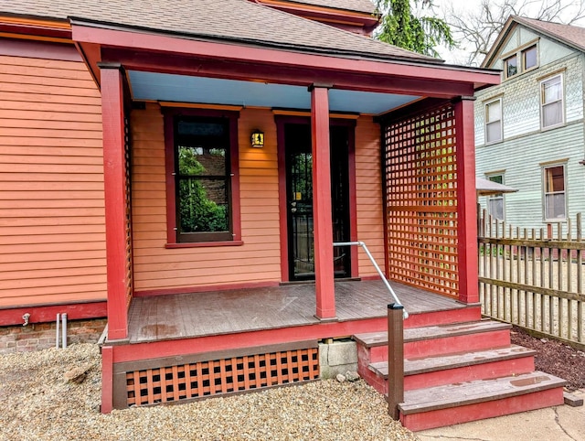 907 W Church St, Champaign, IL 61821 - view of exterior entry with a shingled roof