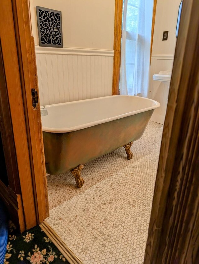 907 W Church St, Champaign, IL 61821 - bathroom with wainscoting and a soaking tub