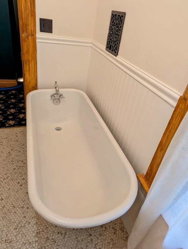 907 W Church St, Champaign, IL 61821 - bathroom with a freestanding tub and wainscoting
