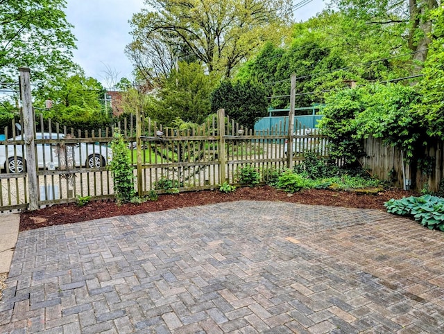 907 W Church St, Champaign, IL 61821 - fenced backyard with a patio area