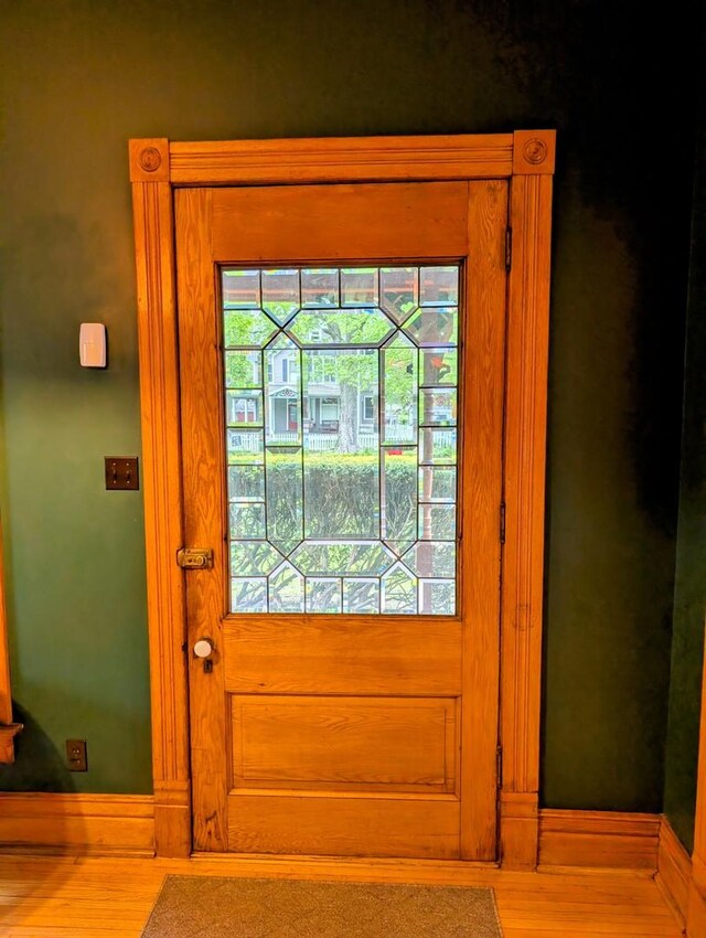 907 W Church St, Champaign, IL 61821 - entryway featuring wood finished floors and baseboards