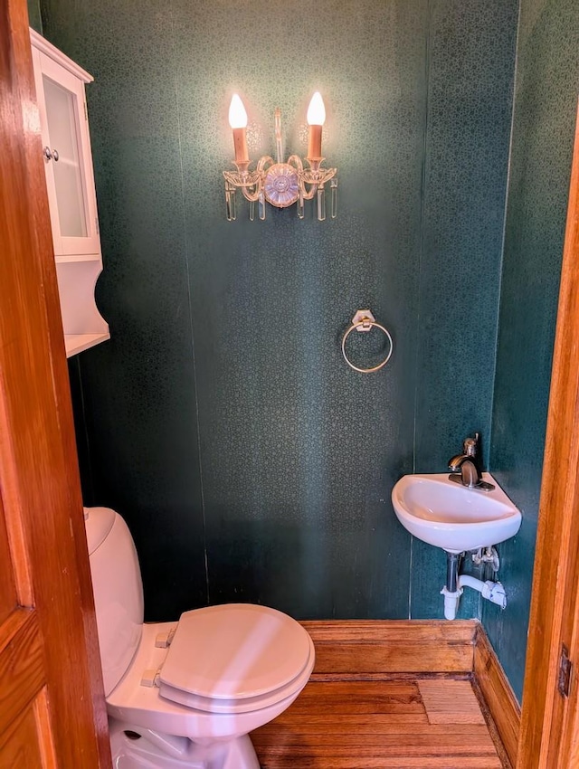 907 W Church St, Champaign, IL 61821 - half bath with toilet, a chandelier, and a sink
