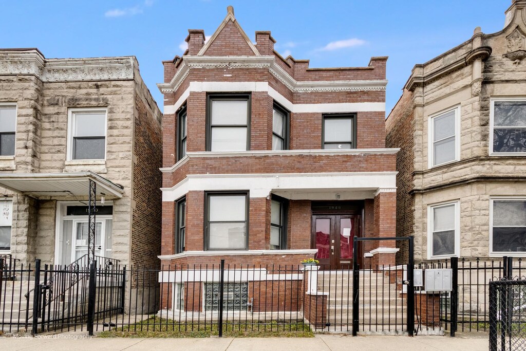 1948 S Trumbull Ave, Chicago, IL 60623 - view of property with a fenced front yard and brick siding