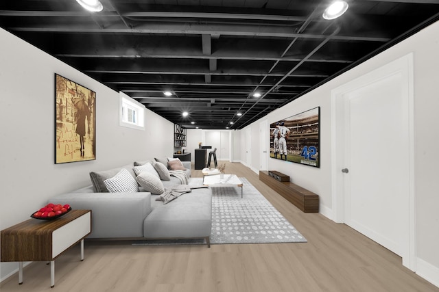 living room with wood finished floors and baseboards